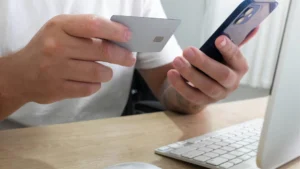 Patient making a payment on their phone. When practices implement modern payment strategies, it ends the cycle of chasing payment.