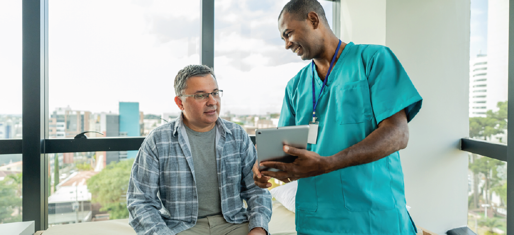 Establishing regular billing cadence - Male doctor explaining medical billing procedures to a male patient.