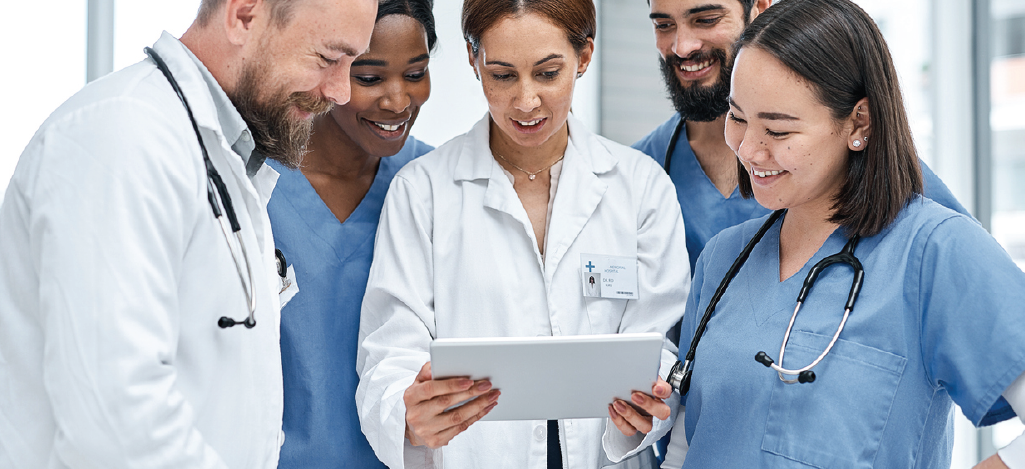 Team of doctors huddled together during a training - improving medical billing process.