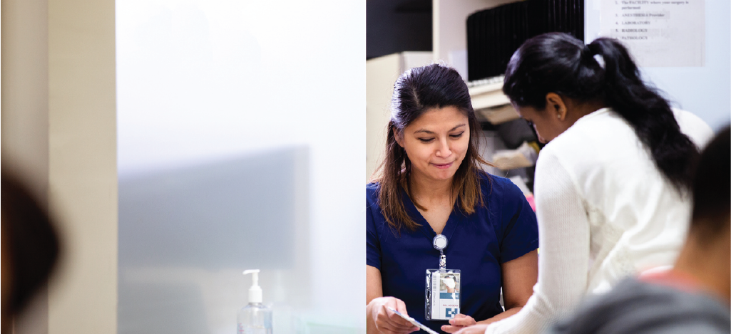 Patient-centric billing approach - Healthcare receptionist assisting a female patient with her bill.