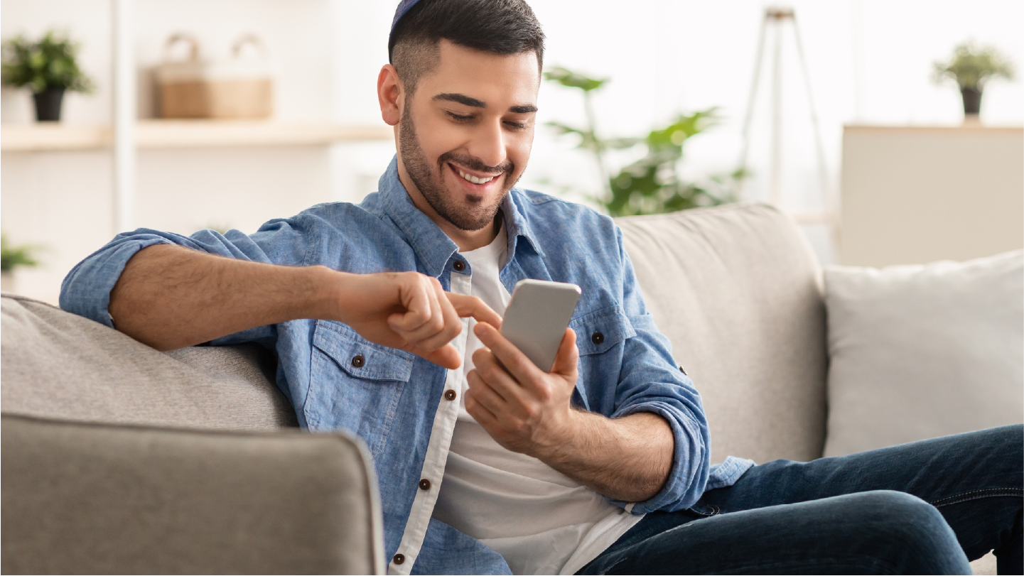 Man looking at a pre-visit-billing message and paying the balance