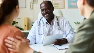 A doctor from a modern medical practice talking to patients