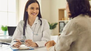 Doctor talking to patient without worrying about medical debt