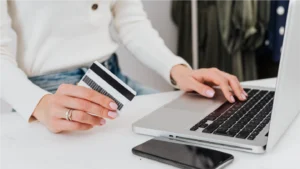 A woman making a payment with their credit card, ending the medical billing chase