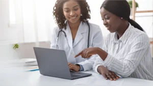 Office managers looking at their medical practice management software