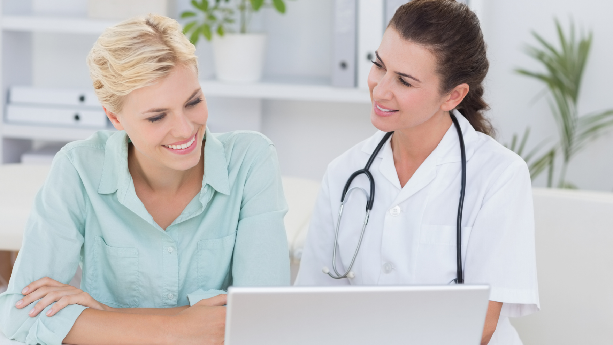 A doctor showing a patient the practice's payment ecosystem