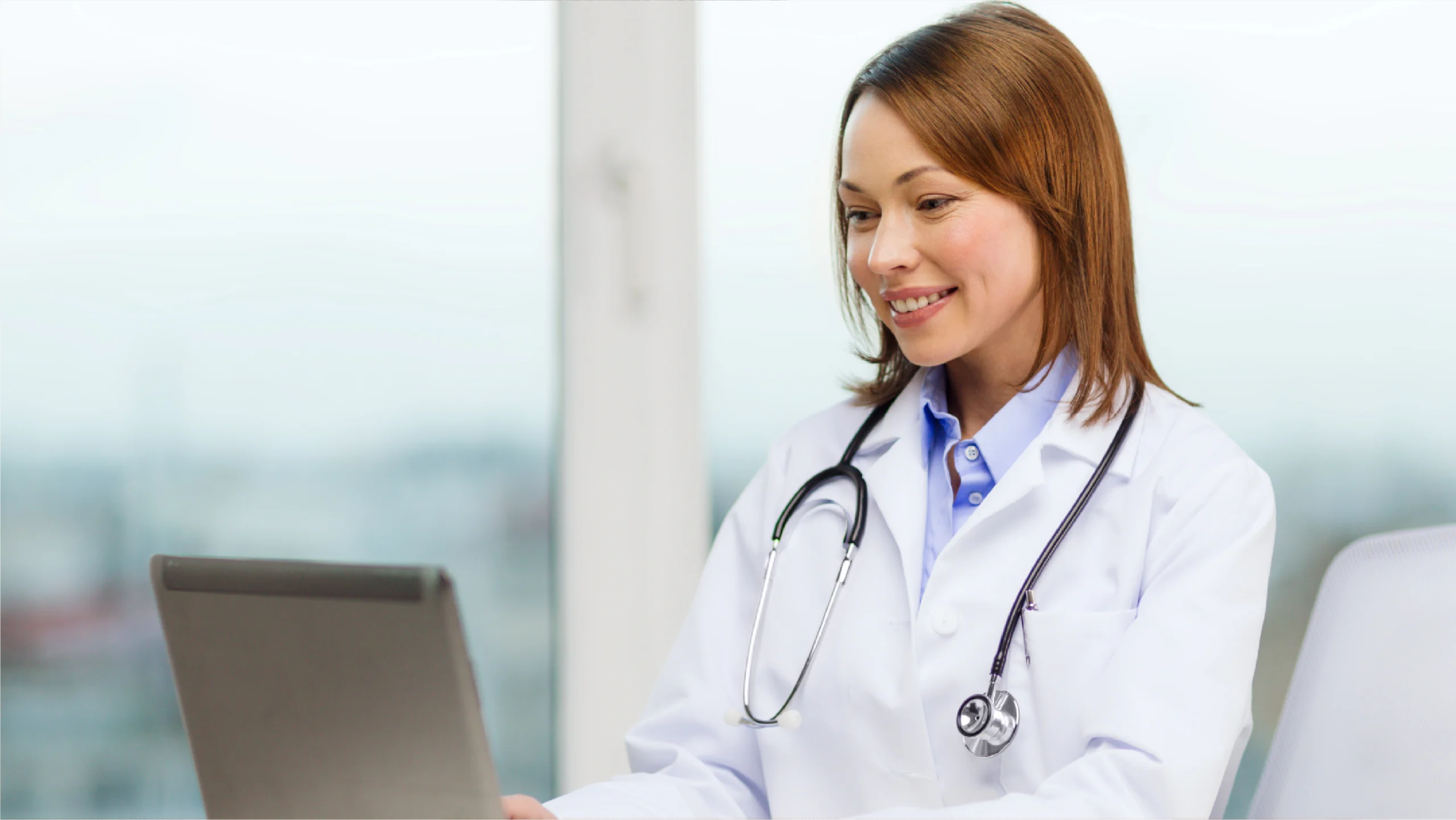 Doctor looking at computer