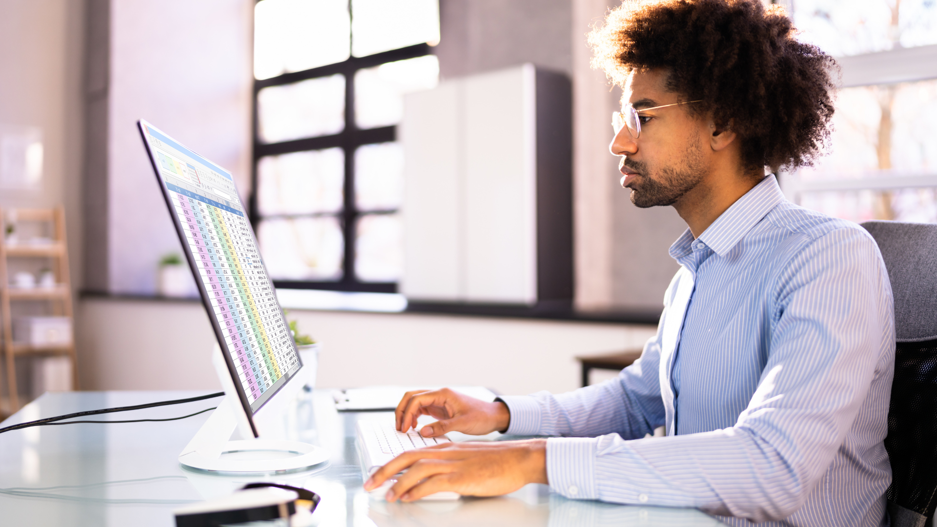 A man looking at the computer combatting the healthcare crisis
