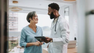 A doctor and patient talking to each other