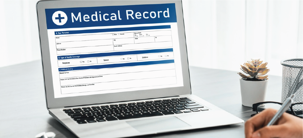 Utilizing effective telehealth billing solutions - A doctor reviewing a patient’s medical record shown on a laptop.