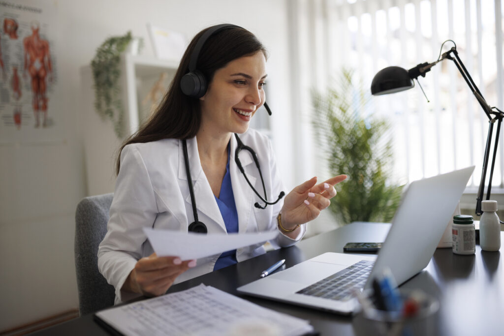 Healthcare technology for telehealth appointments - A female doctor talking to her patient during a telehealth consultation.