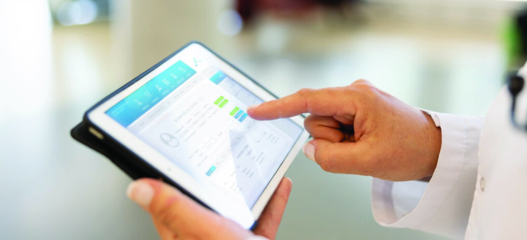 eBill practices for medical practices - A doctor’s hands holding a tablet device showing a patient’s medical bill.