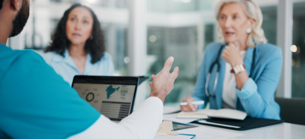 A group of doctors and business owners discussing their practice’s operational data.