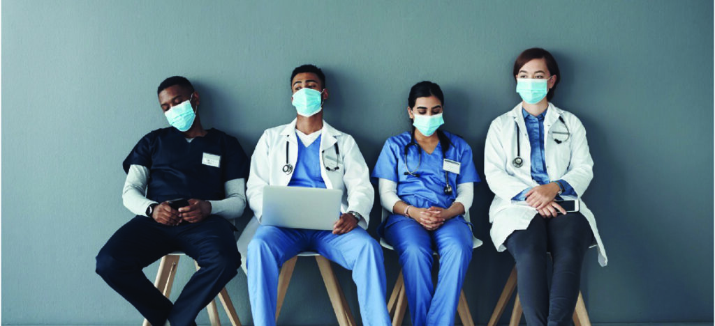 Confronting healthcare burnout - A group of medical professionals experiencing burnout.