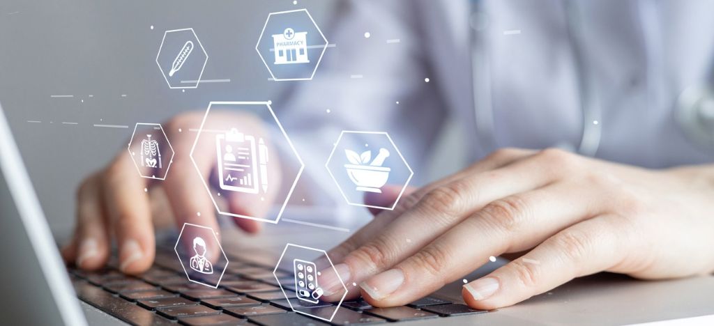 Healthcare professional using a laptop with a digital overlay of multichannel healthcare communication icons.