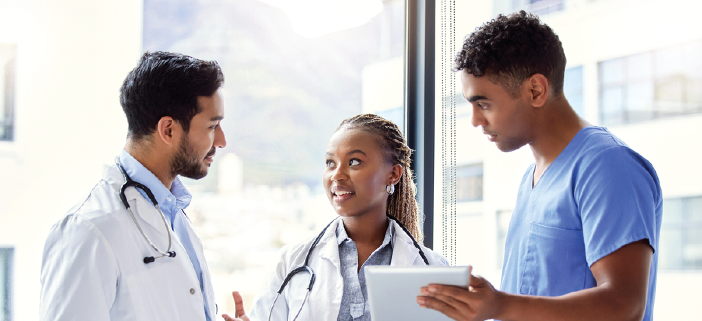 Group of doctors discussing patient policies at work.