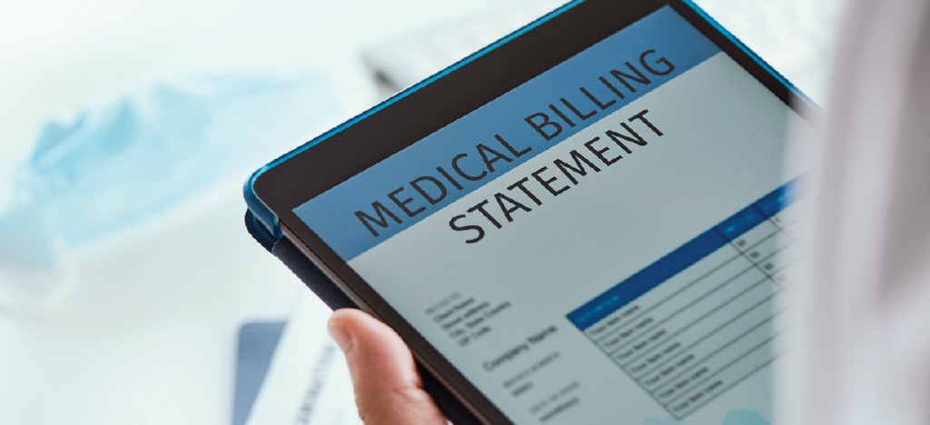 Doctor assessing a patient’s medical billing using a tablet device - avoiding medical billing errors.