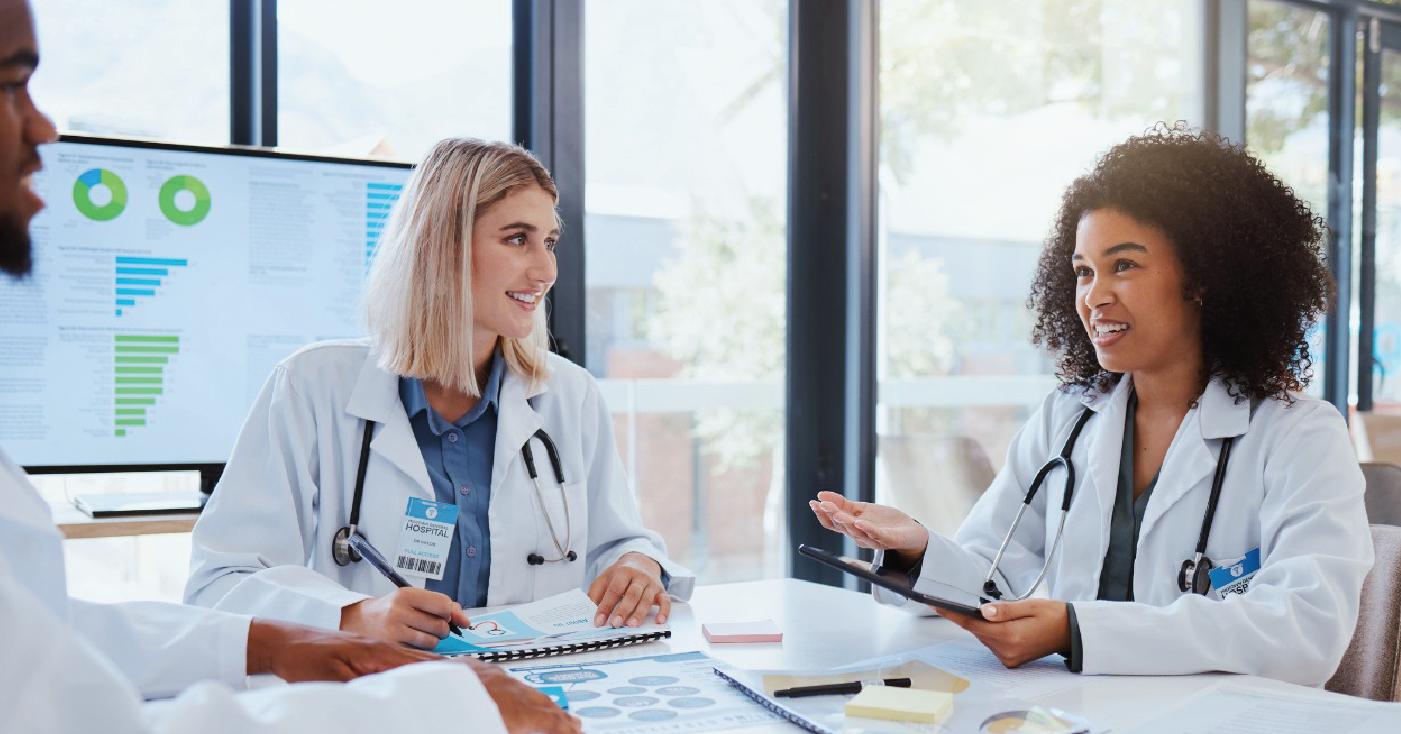 Optimizing revenue cycle - A group of doctors having a meeting about their practice’s revenue.