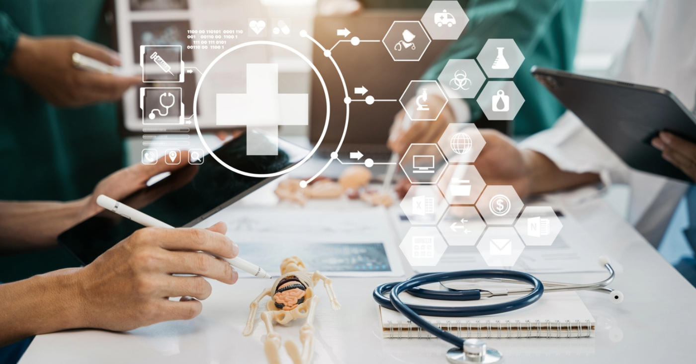 Using a modern billing workflow process - A team of doctors using tablet devices showing different modern healthcare icons.